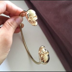 Shiny gold effect double skull arm cuff/bracelet